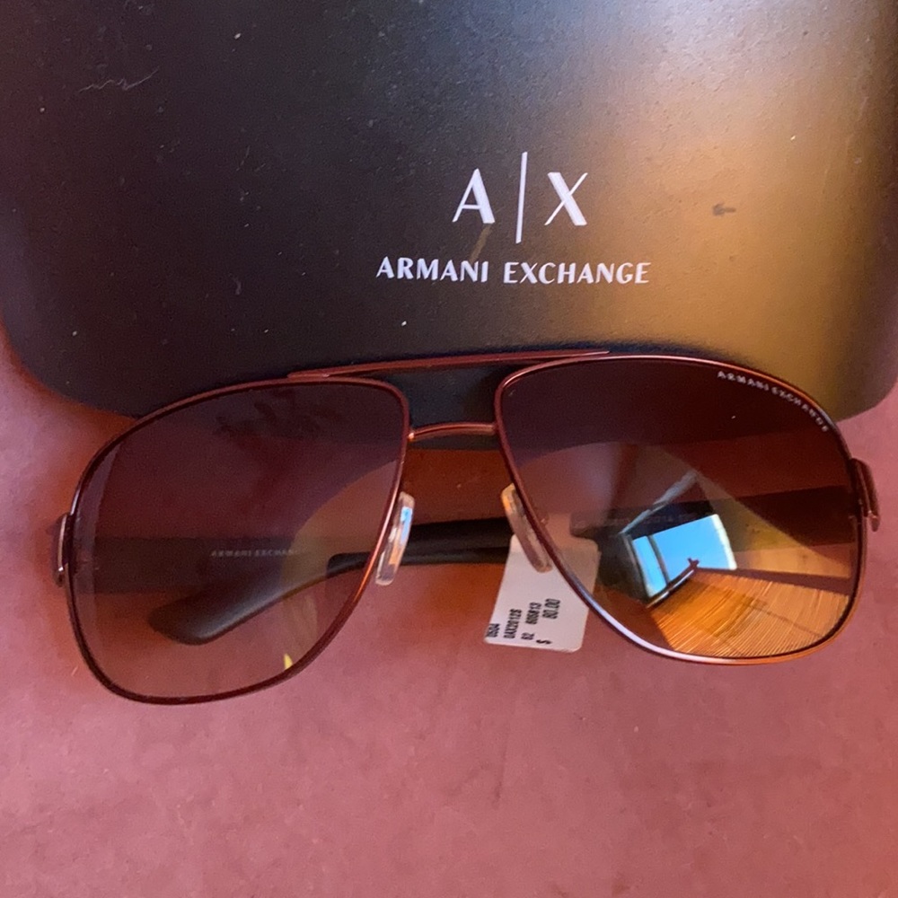 Brand New Armani Exchange Sunglasses with original case and eyeglass cleaner.